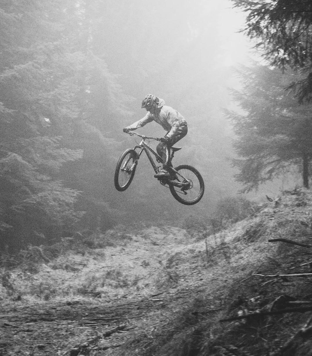 Mountain biker riding through the forest