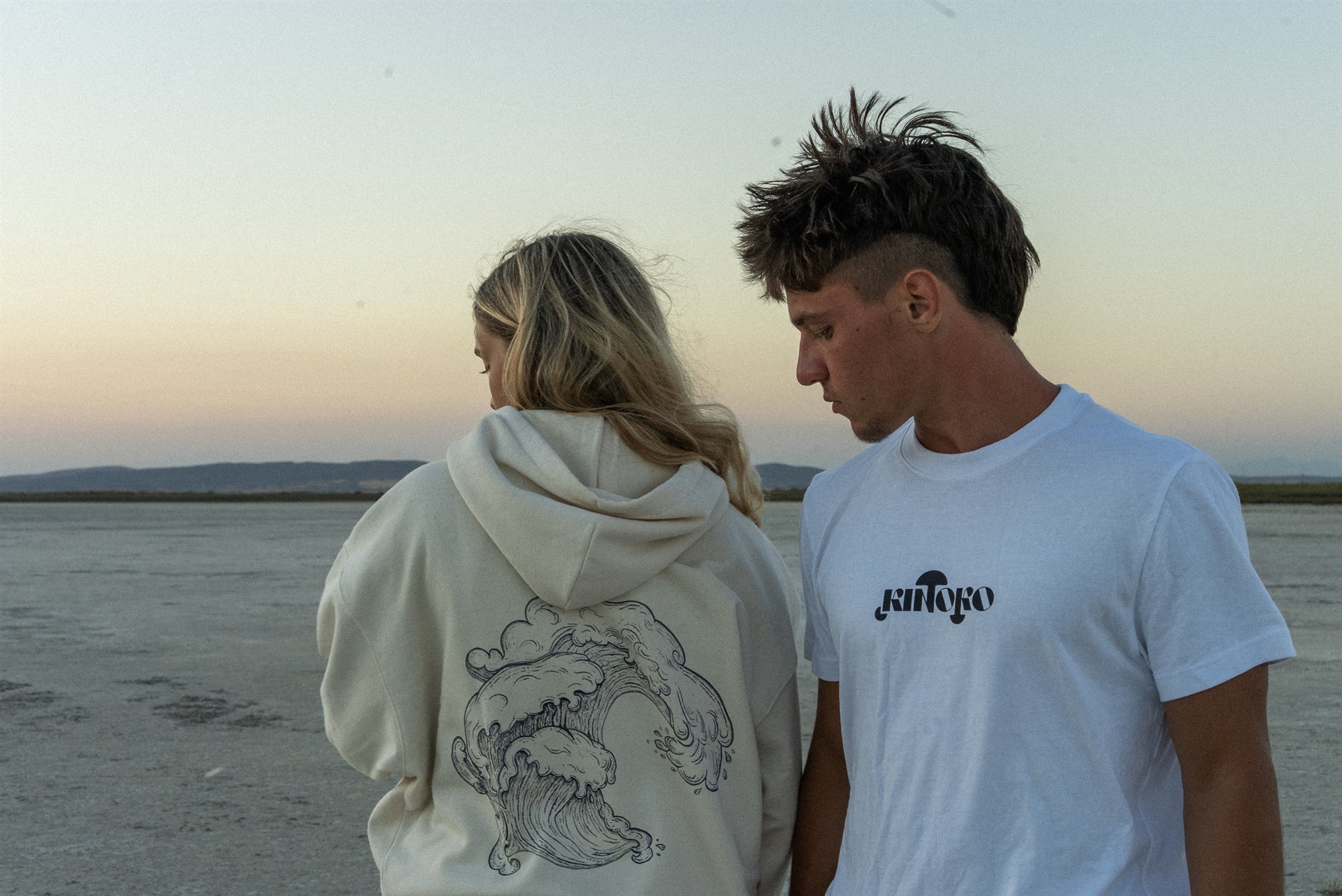 Two friends wearing Kinoko hand-drawn streetwear